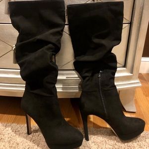Jessica Simpson, Black knee high, platform boots.